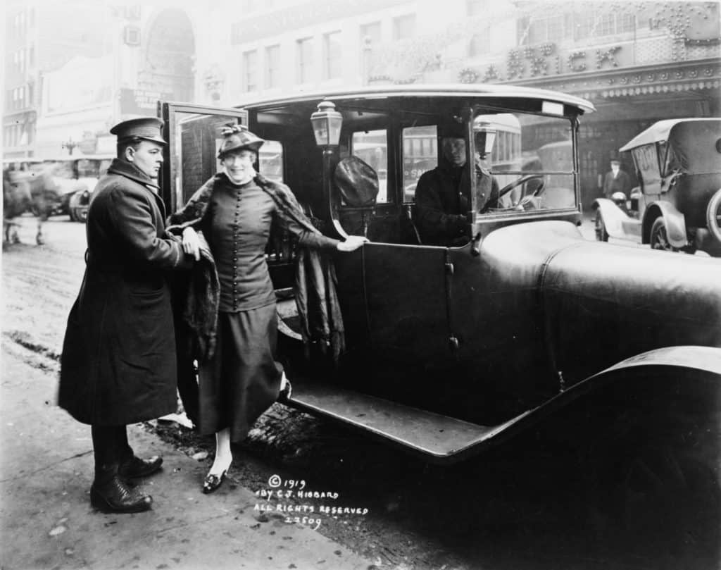 Annette Kellerman exiting "Yellow Cab" taxi-cab, Minneapolis, Minnesota, 1919